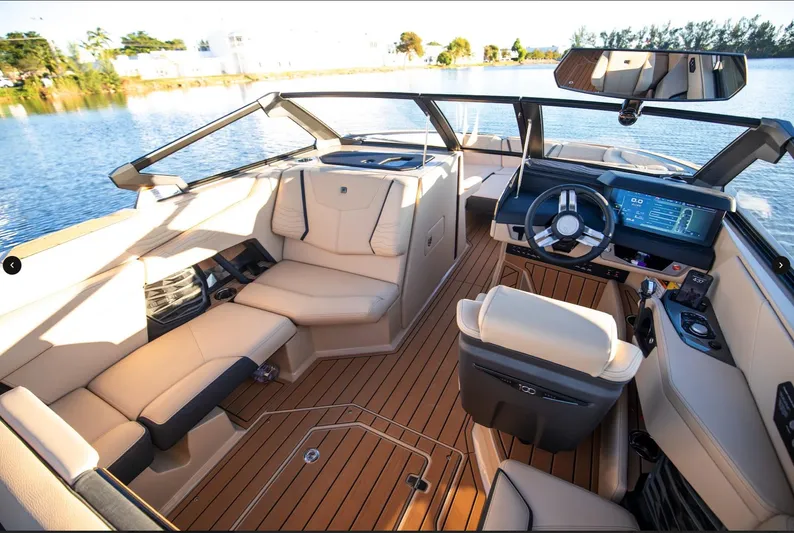  Yacht Photos Pics Interior of 2025 Nautique Super Air Nautique G25 boat with luxurious seating and modern dashboard.