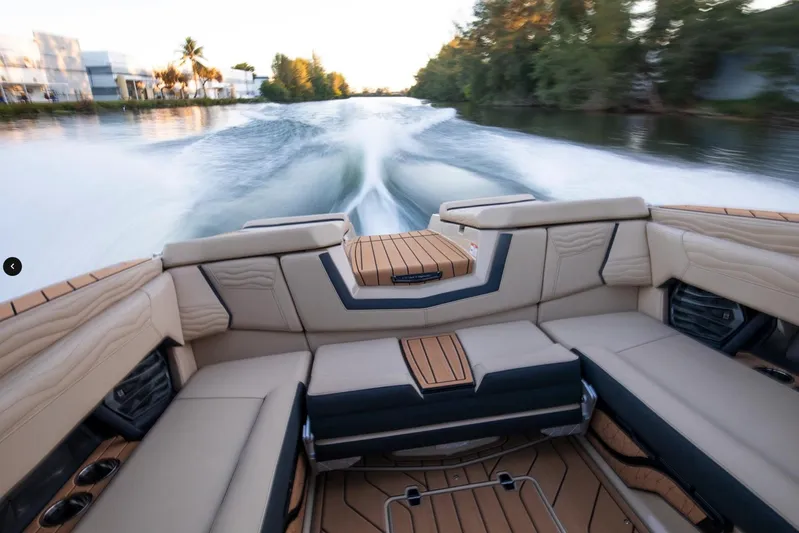  Yacht Photos Pics 2025 Nautique Super Air Nautique G25 cruising on a scenic waterway.