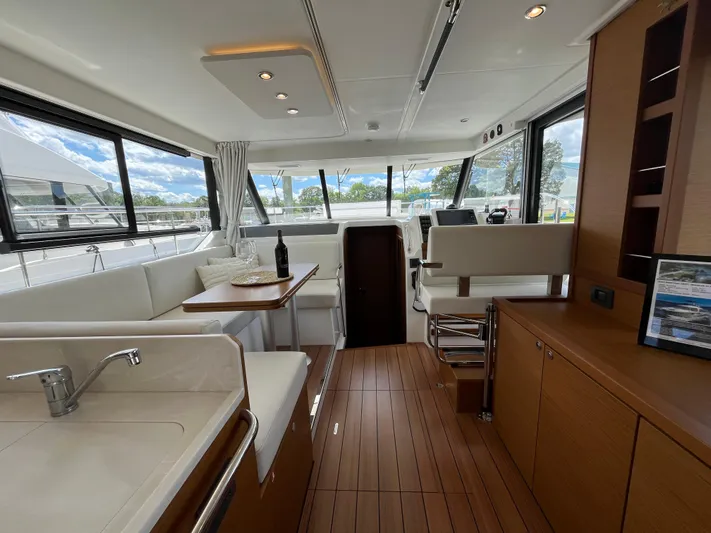  Yacht Photos Pics Interior of 2023 Beneteau Swift Trawler 41 Fly, featuring modern design and spacious seating.