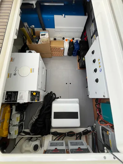  Yacht Photos Pics Engine room of 2023 Beneteau Swift Trawler 41 Fly with equipment and storage.