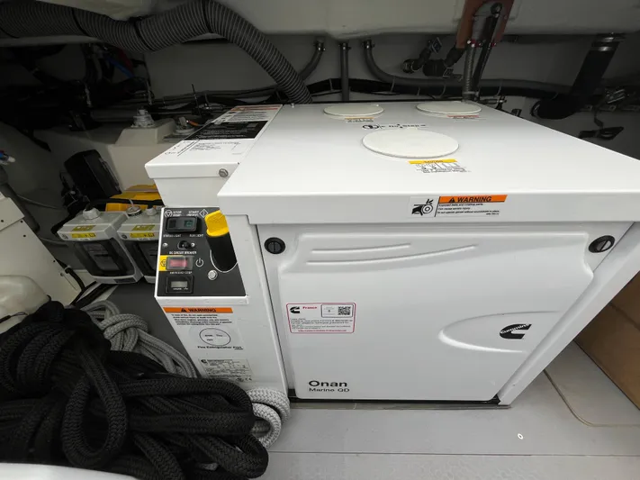  Yacht Photos Pics Engine room of 2023 Beneteau Swift Trawler 41 Fly with Onan Marine generator.