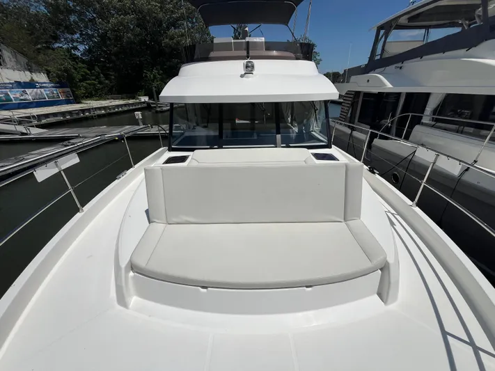  Yacht Photos Pics 2023 Beneteau Swift Trawler 41 Fly, front deck view, docked at marina.
