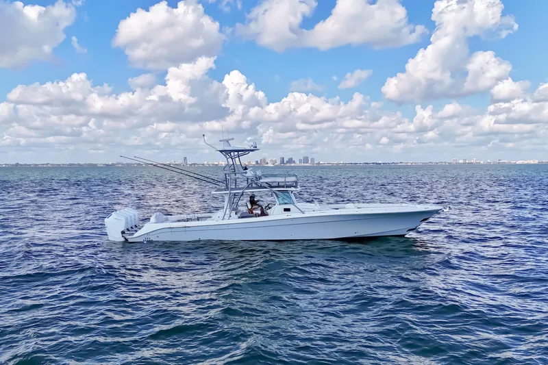  Yacht Photos Pics 2023 HCB 53 Sue&ntilde;os boat cruising on open water under a partly cloudy sky.