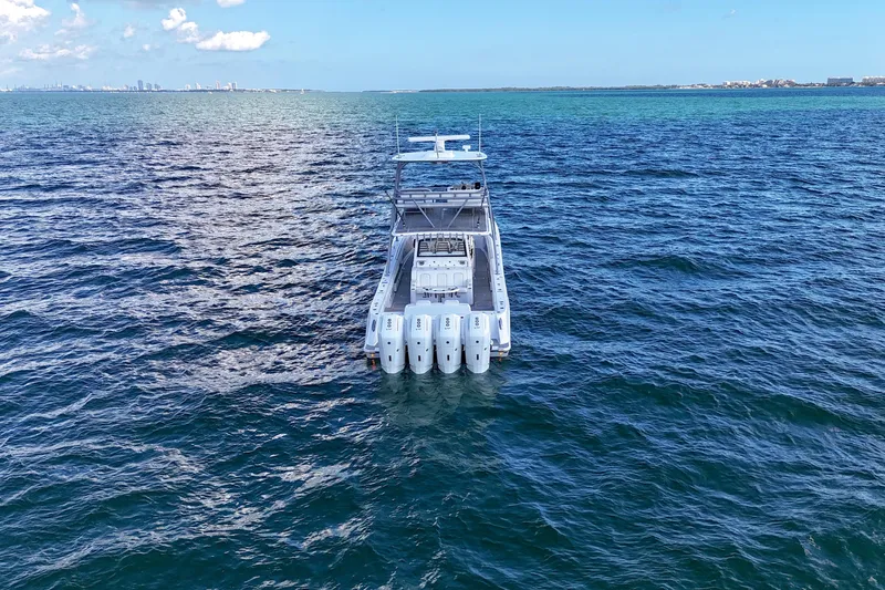  Yacht Photos Pics 2023 HCB 53 Sue&ntilde;os boat on open ocean, clear blue sky.