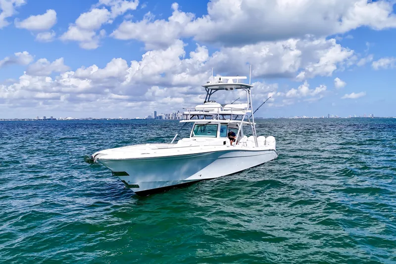  Yacht Photos Pics 2023 HCB 53 Sue&ntilde;os boat on open water under a partly cloudy sky.