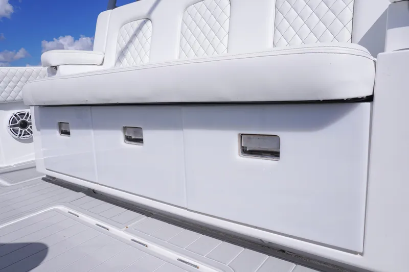  Yacht Photos Pics 2023 HCB 53 Sue&ntilde;os boat seating with white quilted upholstery and storage compartments.