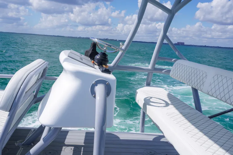  Yacht Photos Pics 2023 HCB 53 Sue&ntilde;os boat helm with ocean view, featuring sleek seating and modern design.