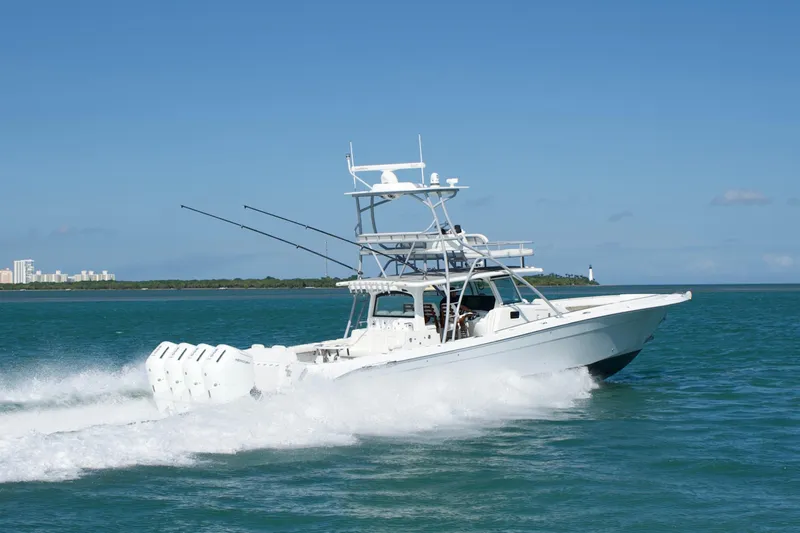  Yacht Photos Pics 2024 HCB 53 Sueños boat cruising on blue ocean waters under clear sky.