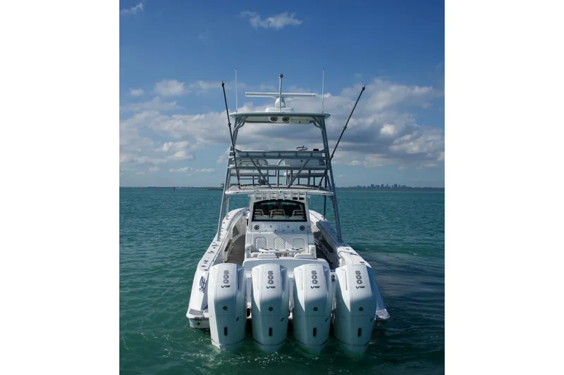  Yacht Photos Pics 2024 HCB 53 Sueños boat with four powerful engines on open water.