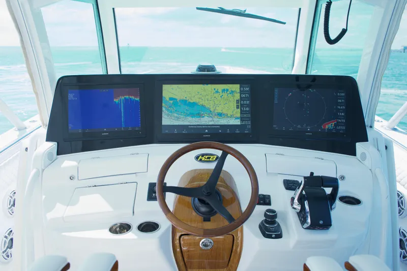  Yacht Photos Pics 2024 HCB 53 Sueños boat helm with advanced navigation displays and controls.