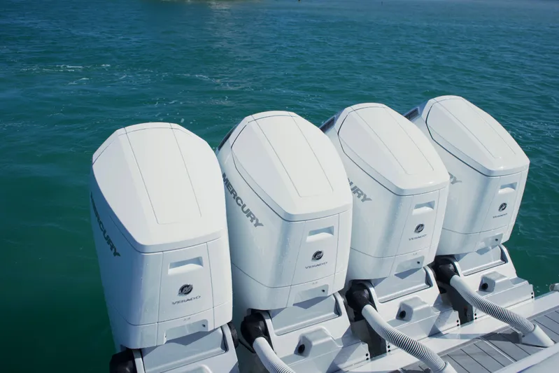  Yacht Photos Pics Four Mercury outboard engines on a 2024 HCB 53 Sueños boat in blue water.