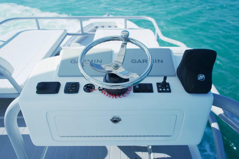  Yacht Photos Pics Helm of 2024 HCB 53 Sueños boat with Garmin controls on open water.