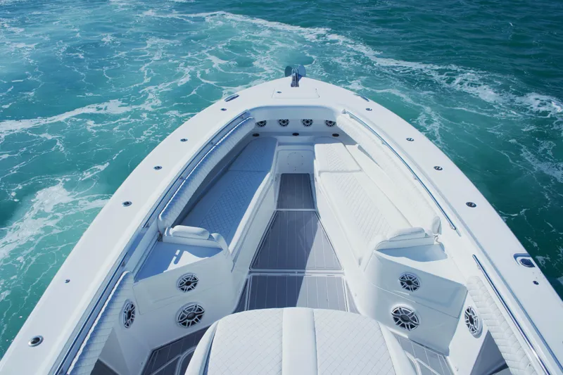  Yacht Photos Pics 2024 HCB 53 Sueños boat deck with luxurious seating on open water.