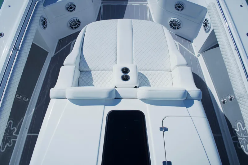  Yacht Photos Pics 2024 HCB 53 Sueños boat interior with luxurious white seating and speaker system.