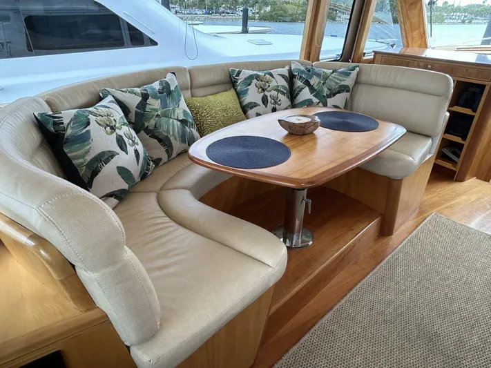 Alacrity Yacht Photos Pics Luxurious interior of 2008 Lyman-Morse Flybridge 62' yacht with elegant seating and tropical decor.