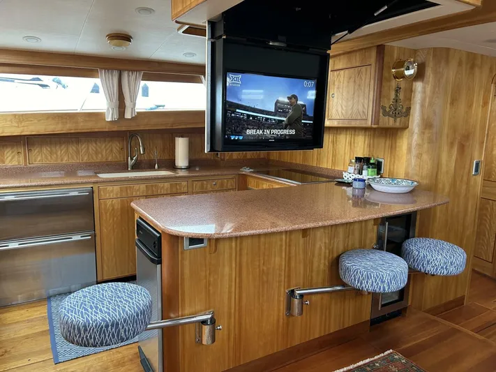 Alacrity Yacht Photos Pics Luxurious interior of 2008 Lyman-Morse Flybridge 62' yacht with modern kitchen and TV.