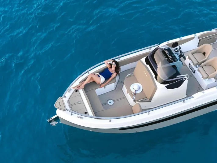  Yacht Photos Pics 2025 Ranieri 275 LS boat on clear blue water, featuring a sunbathing area.