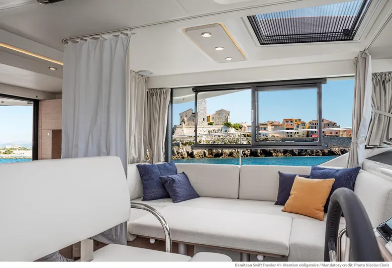 In Stock Yacht Photos Pics Interior of 2024 Beneteau Swift Trawler 41 Sedan with scenic ocean view.