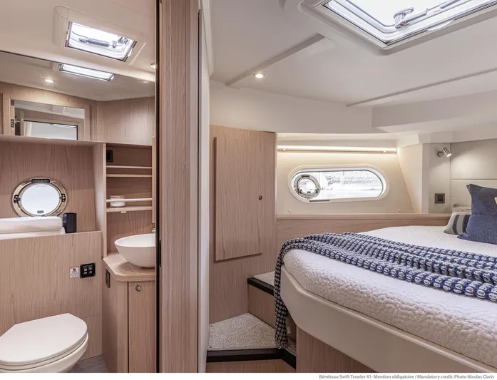 In Stock Yacht Photos Pics 2024 Beneteau Swift Trawler 41 Sedan interior with modern bedroom and bathroom design.
