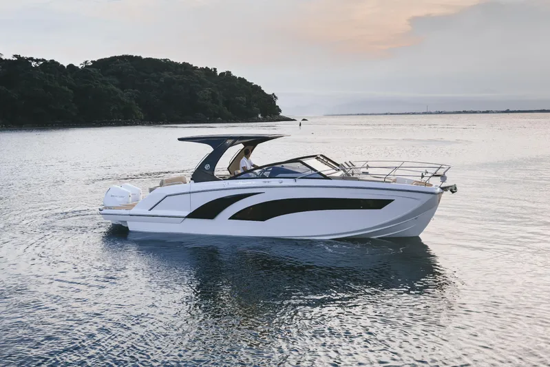  Yacht Photos Pics 2024 Hanover 347 White & Black Edition boat cruising on calm waters at sunset.