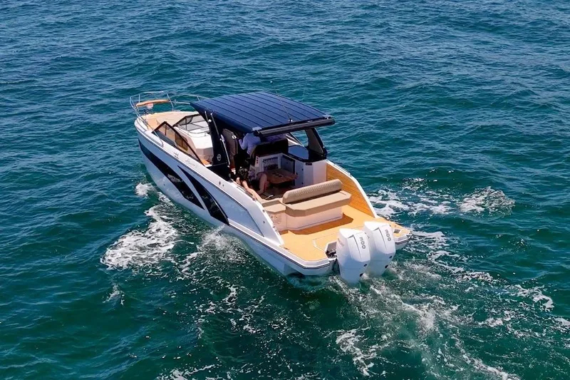  Yacht Photos Pics 2024 Hanover 347 White & Black Edition boat cruising on open water.