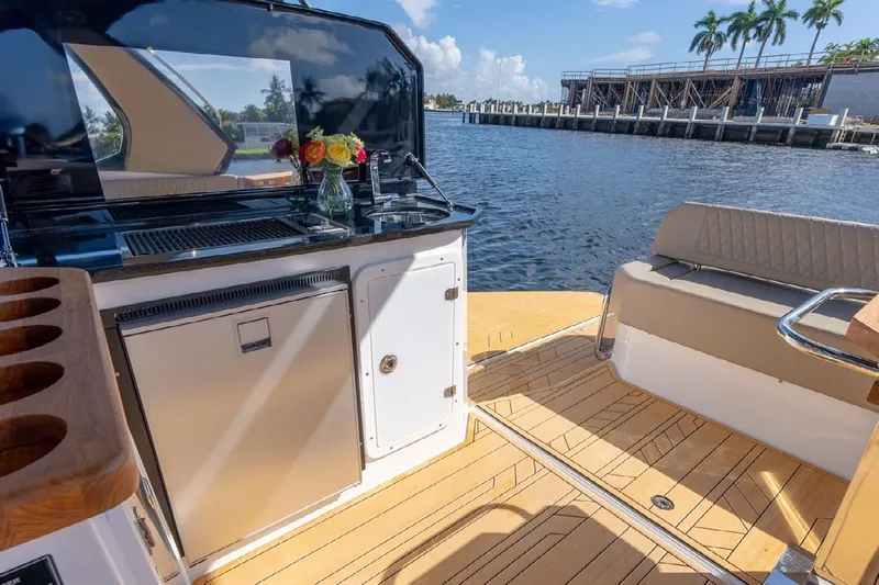  Yacht Photos Pics Luxurious 2024 Hanover 347 yacht interior with elegant seating and waterfront view.