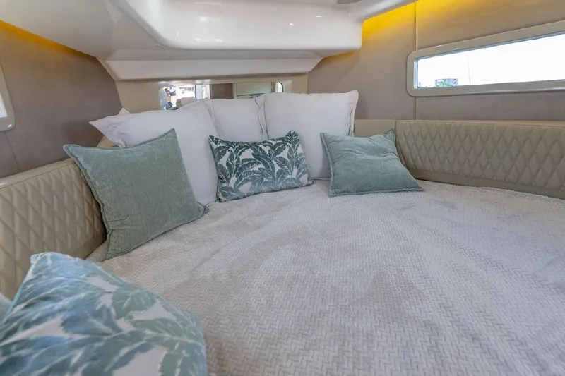  Yacht Photos Pics Luxurious interior of 2024 Hanover 347 White & Black Edition yacht with plush bedding.