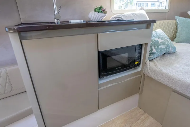  Yacht Photos Pics 2024 Hanover 347 White & Black Edition interior with microwave and modern cabinetry.