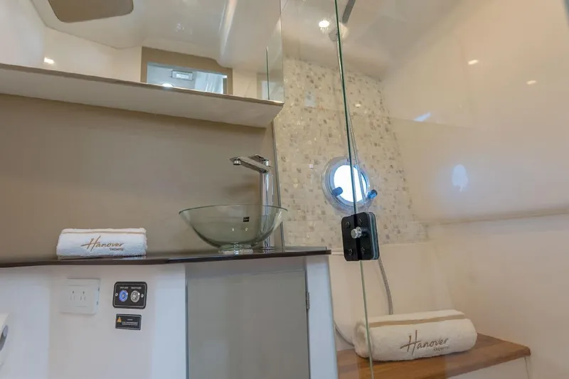  Yacht Photos Pics Luxurious bathroom in 2024 Hanover 347 White & Black Edition yacht, featuring modern fixtures and elegant design.