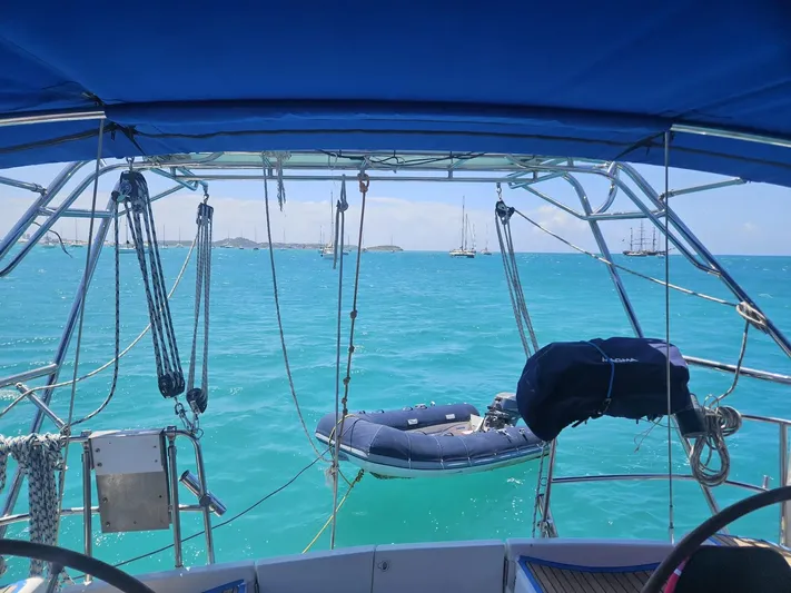 Helix Yacht Photos Pics View from Jeanneau 44i sailboat, turquoise sea, inflatable dinghy, clear sky, 2011 model.