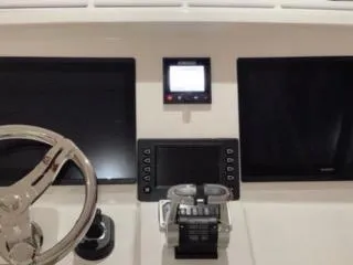 Touche Yacht Photos Pics 2017 Intrepid 475 Sport Yacht helm with dual screens and steering wheel.