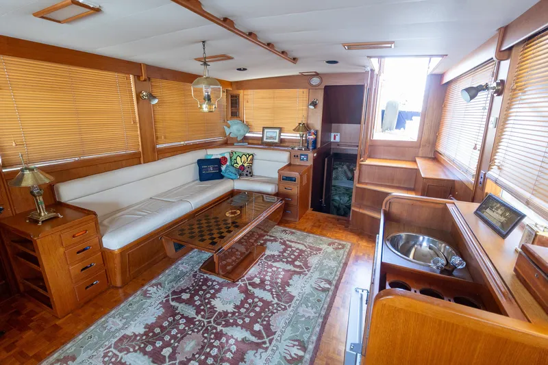  Yacht Photos Pics Luxurious 1994 Grand Banks 49 Motoryacht interior with elegant wood finishes and comfortable seating.