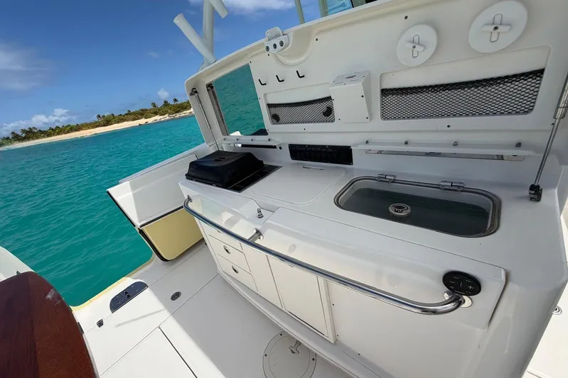  Yacht Photos Pics Boston Whaler 370 Outrage 2010 boat interior with kitchen setup, ocean view.