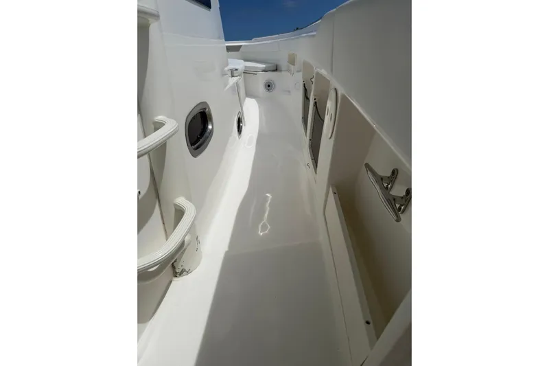  Yacht Photos Pics Boston Whaler 370 Outrage 2010 boat deck with sleek white finish and stainless steel fixtures.