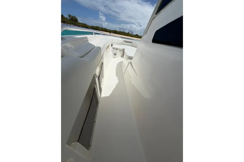 Yacht Photos Pics 2010 Boston Whaler 370 Outrage boat deck with sleek design and ocean backdrop.