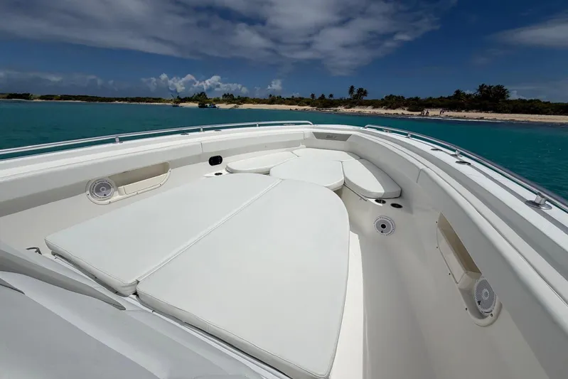  Yacht Photos Pics 2010 Boston Whaler 370 Outrage boat interior with cushioned seating, ocean view, and clear skies.