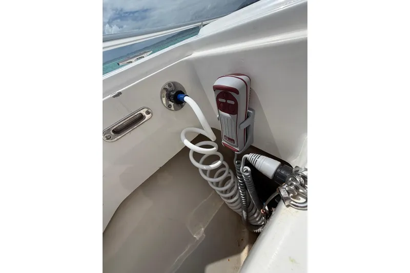  Yacht Photos Pics 2010 Boston Whaler 370 Outrage boat deck with coiled hose and control panel.