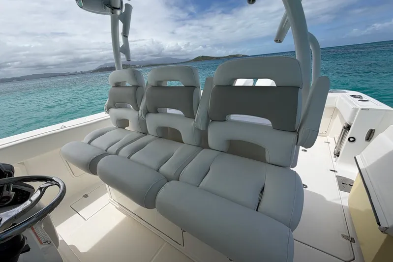  Yacht Photos Pics 2010 Boston Whaler 370 Outrage boat interior with plush seating, ocean view.