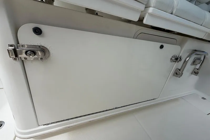  Yacht Photos Pics 2010 Boston Whaler 370 Outrage storage compartment with secure latch and handle.