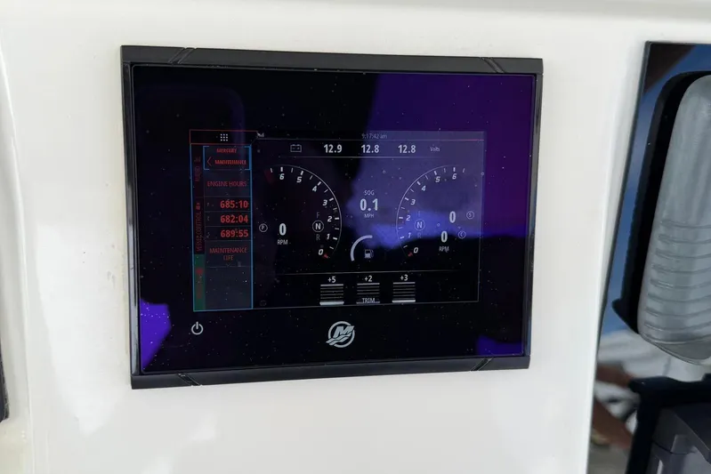  Yacht Photos Pics Dashboard display of a 2010 Boston Whaler 370 Outrage showing engine metrics and maintenance data.