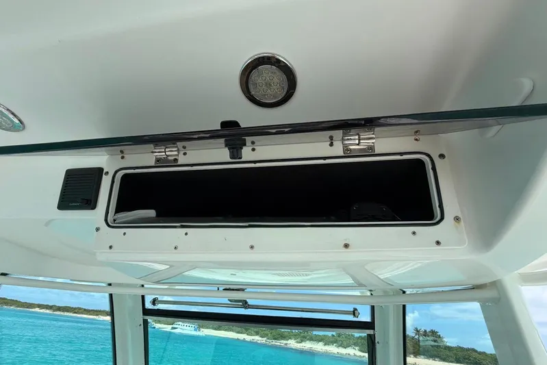  Yacht Photos Pics Open storage compartment on a 2010 Boston Whaler 370 Outrage boat, with ocean view.