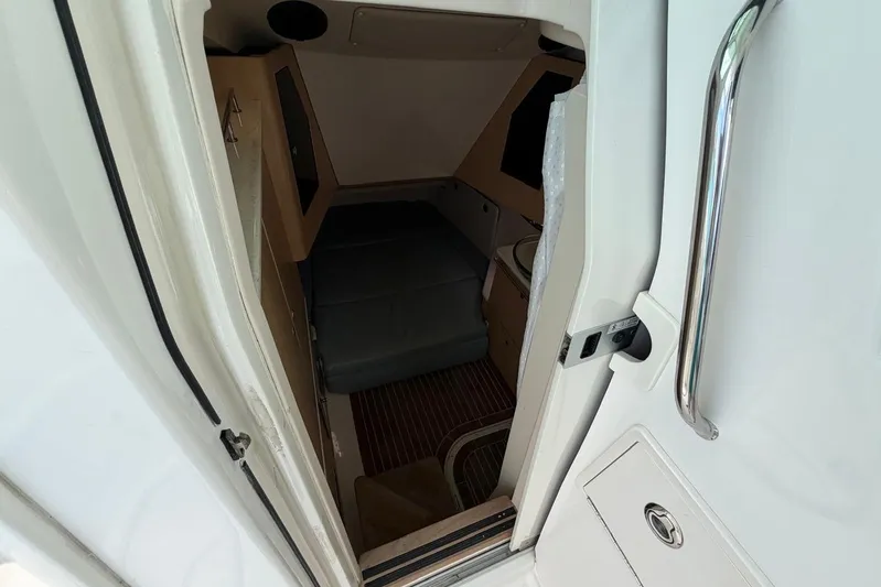  Yacht Photos Pics Interior cabin view of 2010 Boston Whaler 370 Outrage boat, featuring seating and storage.