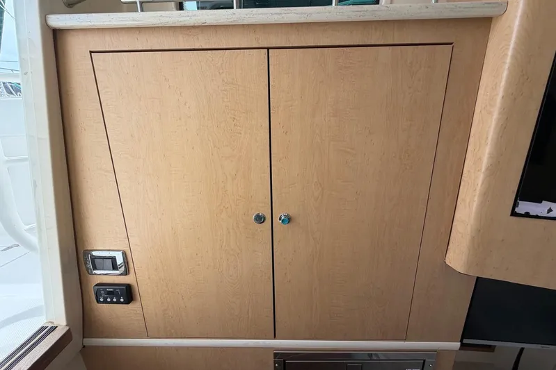  Yacht Photos Pics Wooden cabinet doors on a 2010 Boston Whaler 370 Outrage boat interior.