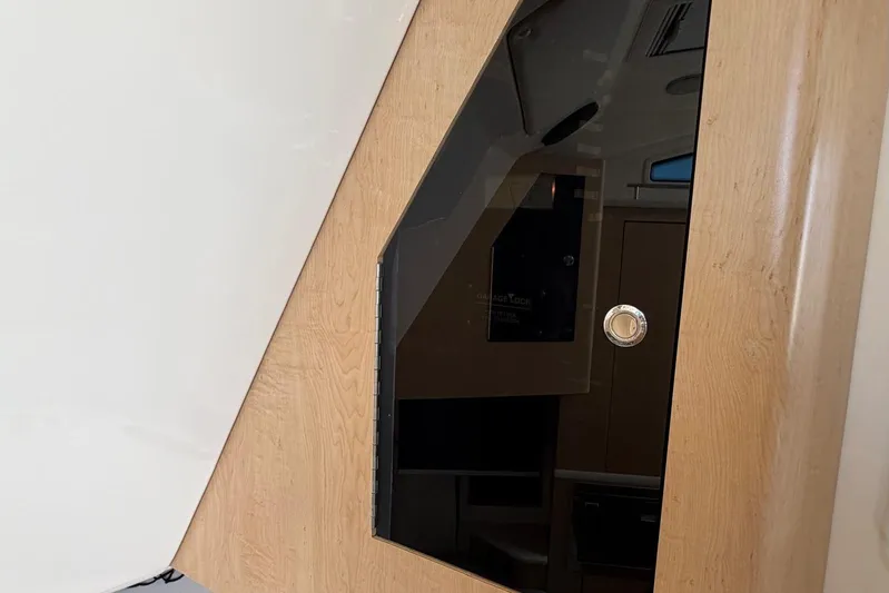  Yacht Photos Pics Interior view of a 2010 Boston Whaler 370 Outrage, featuring a sleek wooden door design.