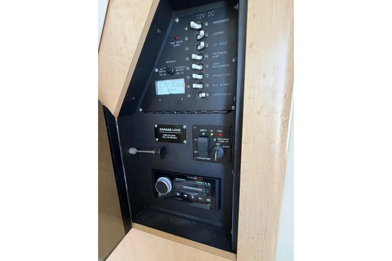  Yacht Photos Pics Control panel of a 2010 Boston Whaler 370 Outrage boat, featuring various switches and gauges.