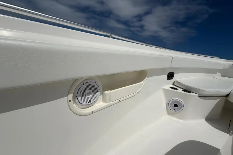  Yacht Photos Pics 2010 Boston Whaler 370 Outrage interior with speakers and seating under a clear sky.
