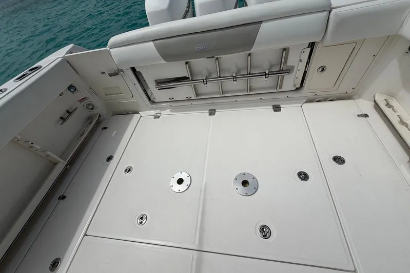  Yacht Photos Pics 2010 Boston Whaler 370 Outrage deck with storage compartments and seating.