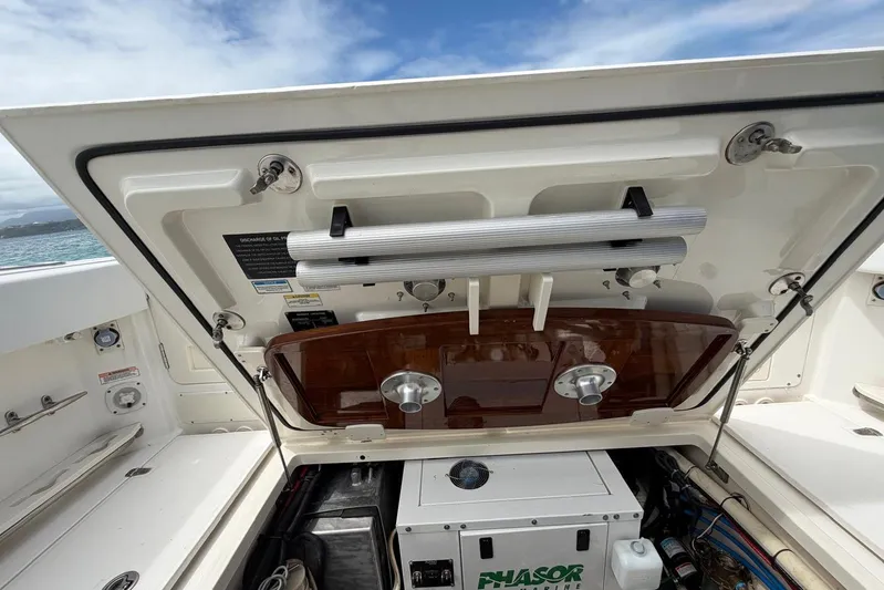  Yacht Photos Pics Boston Whaler 370 Outrage 2010 boat engine compartment with open hatch and equipment.