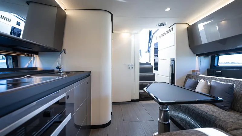 G-jazss Yacht Photos Pics Interior of 2022 Azimut Verve 47 yacht, featuring modern kitchen and seating area.