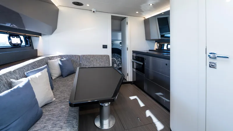 G-jazss Yacht Photos Pics Interior of 2022 Azimut Verve 47 yacht, featuring modern seating and kitchen area.